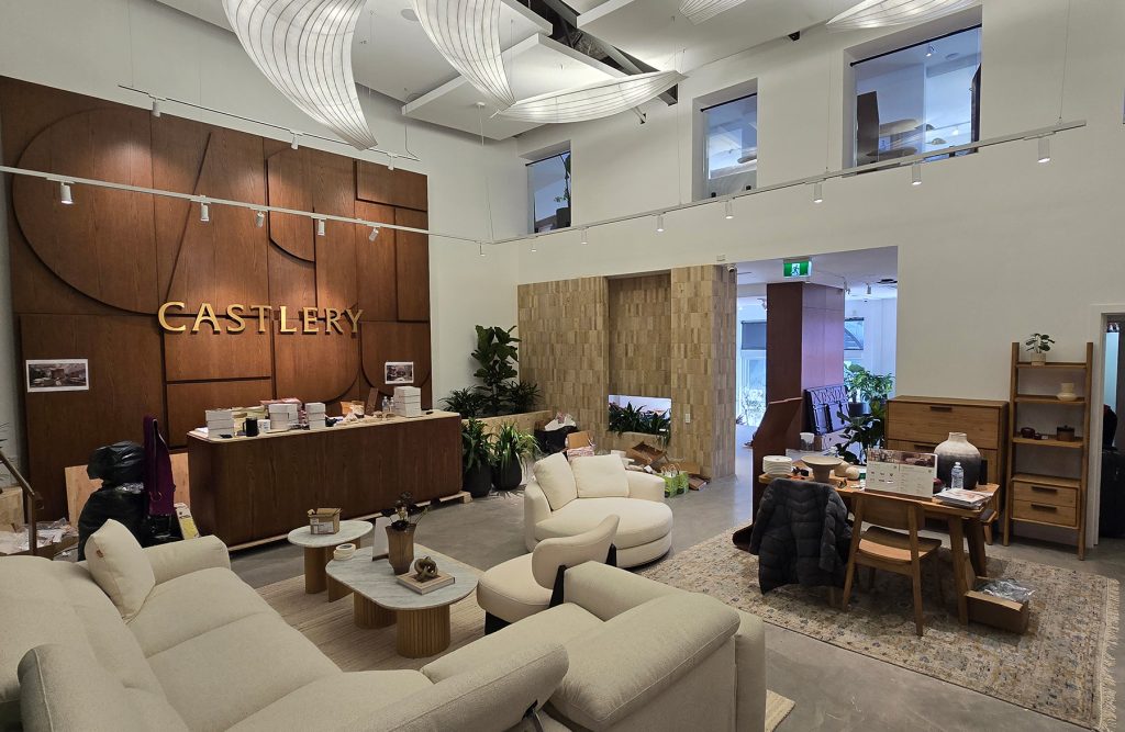 Castlery Showroom displaying the furniture throughout, along with the feature wall.