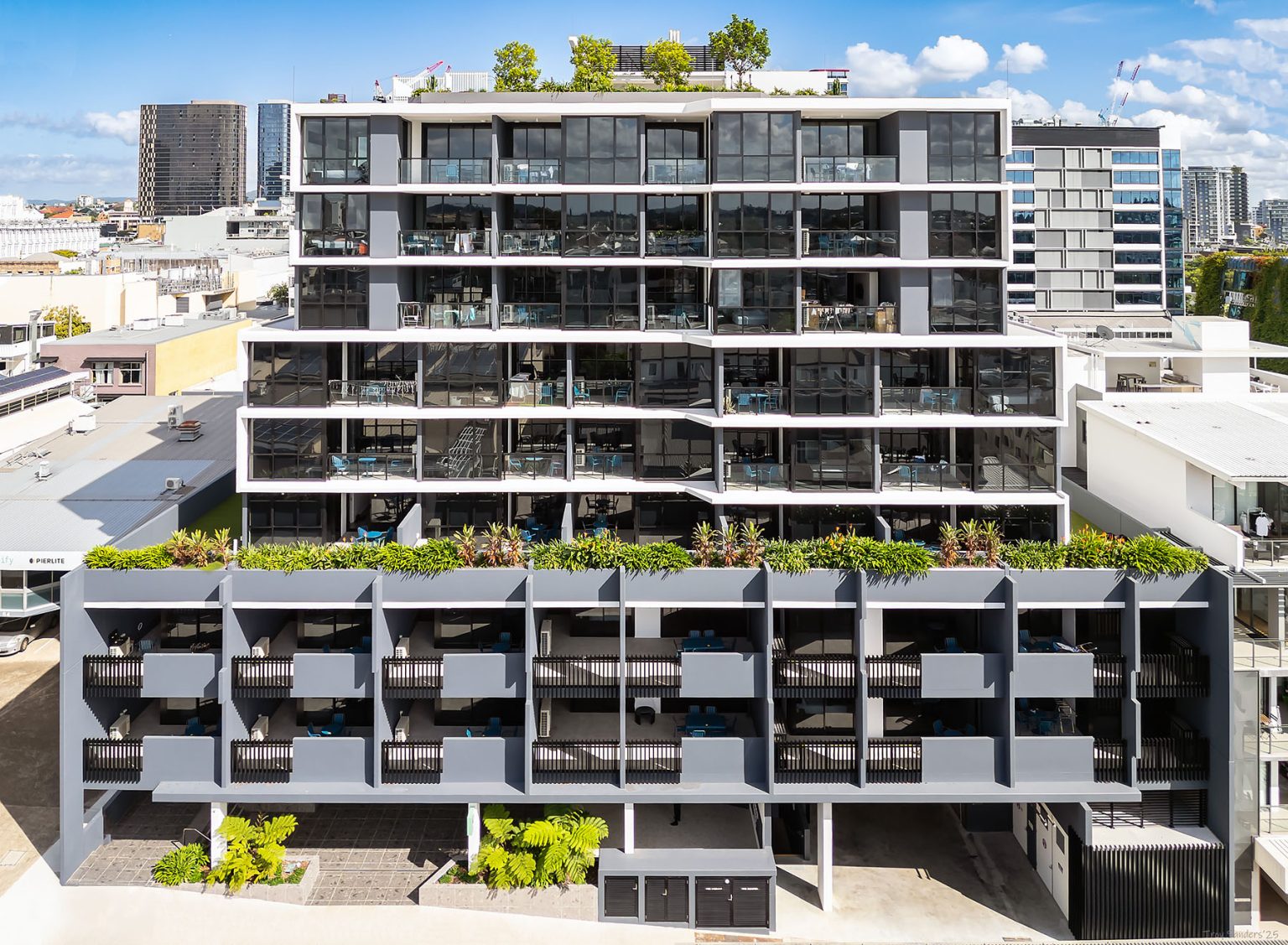 Multi-residential building, Grey & White, exterior image, balconies on each apartment with full front glazing.